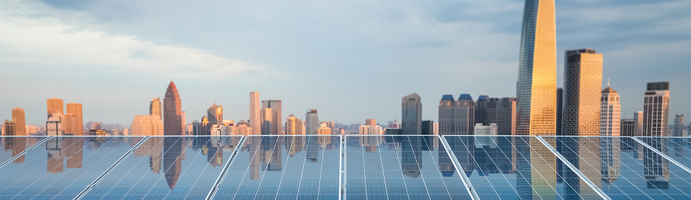 solar panels in front of a skyline